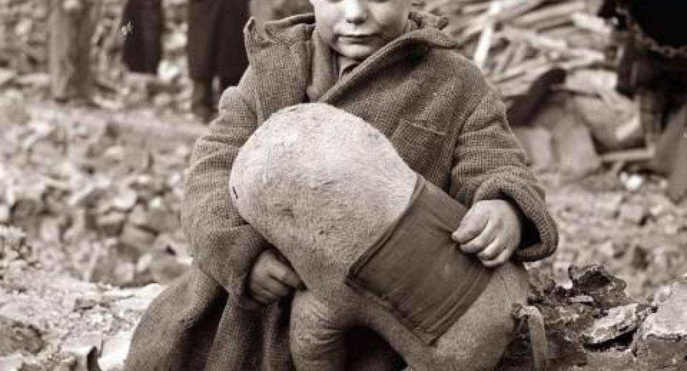 When looking for inspirational images to create my World War II character, I saw this young boy lost in the rubble of war and loved how he clung to his toy.